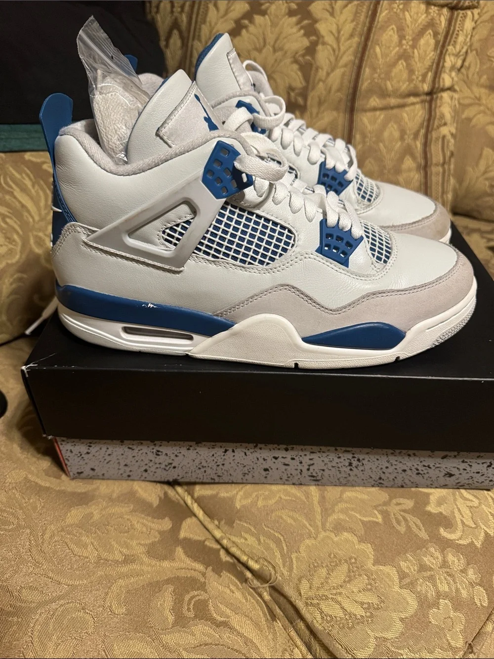 Jordan Men’s Retro 4 White and Blue Sneakers